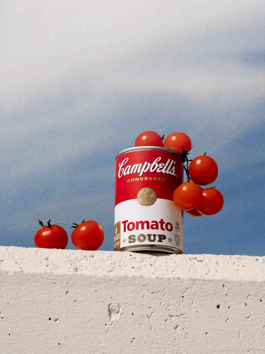A conceptual still life series exploring the dialogue between iconic Campbell’s Tomato Soup branding and fresh produce. Photographed by Irina Lokteva Pikalova (Irina Lopik), the project merges pop cultural references with natural textures, using light, color, and composition to highlight both the product’s heritage and its organic inspiration.