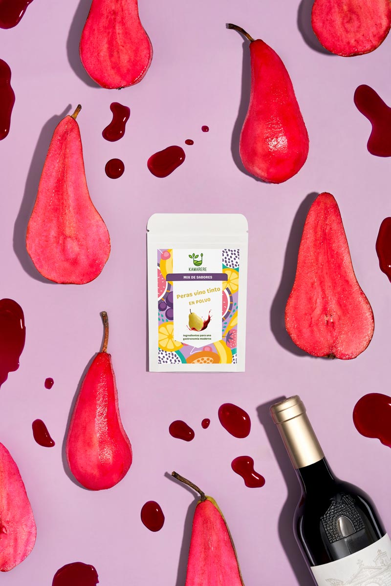 Captivating flat lay photograph featuring a white packaging filled with a finely powdered blend of fresh seasonal ingredients. Surrounding the packaging, you'll find juicy pears in red wine and a bottle of red wine red wine of the highest quality. This exquisite studio product photography showcases the essence of the Kamarere food brand.