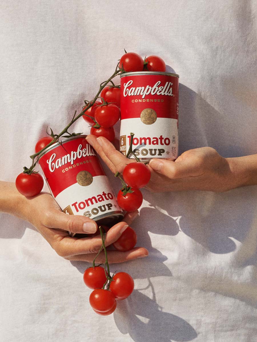 A conceptual still life series exploring the dialogue between iconic Campbell’s Tomato Soup branding and fresh produce. Photographed by Irina Lokteva Pikalova (Irina Lopik), the project merges pop cultural references with natural textures, using light, color, and composition to highlight both the product’s heritage and its organic inspiration.